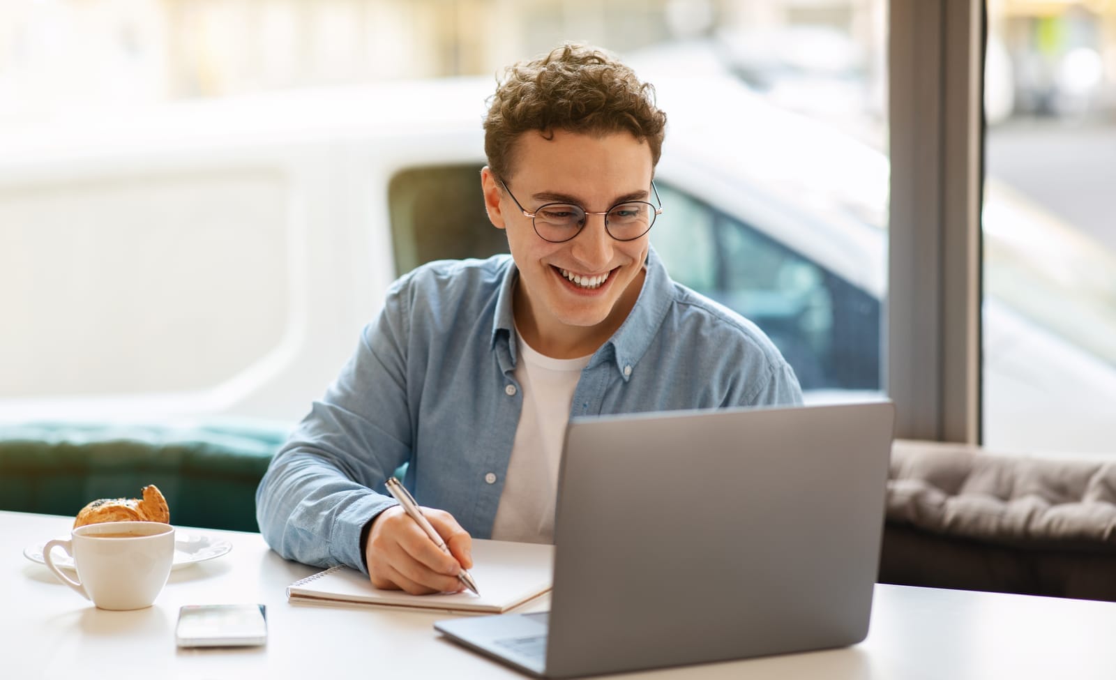 57172028_smiling-millennial-european-guy-in-glasses-typing-on-laptop-work-study-or-online-communication.jpg